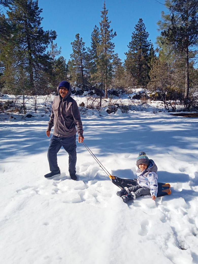 Vishal's family playing in the snow.