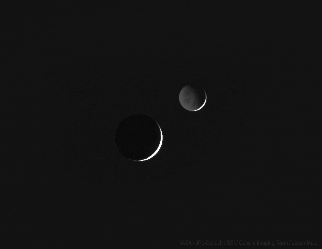 black and white image of the two moons close to one another