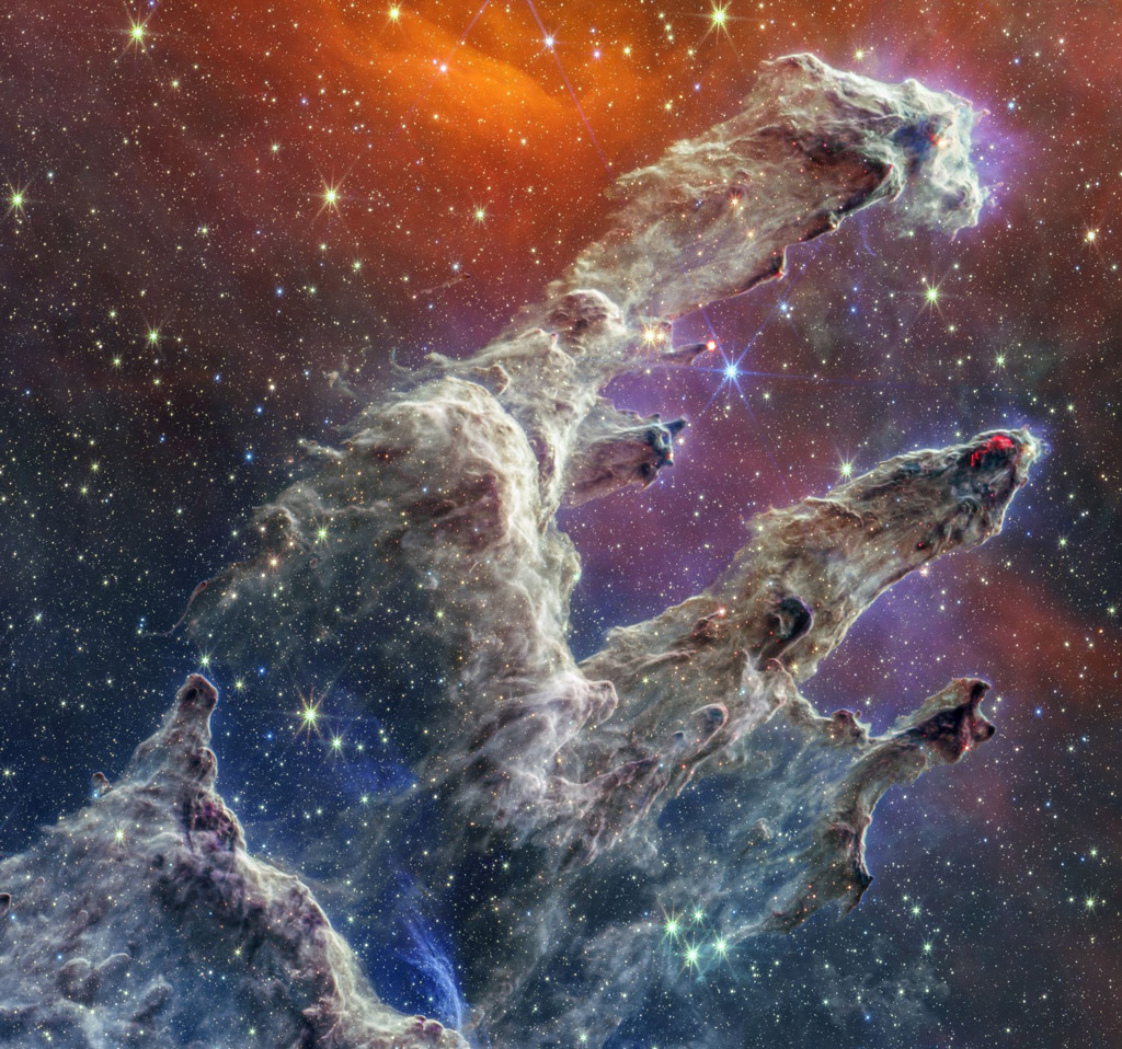 colorful view of the pillars of creation which resembles a hand.