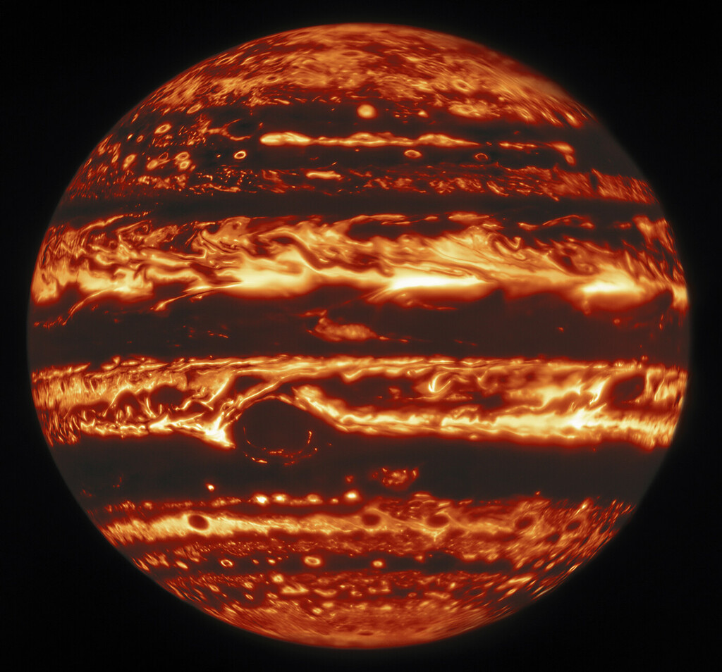 infrared view of Jupiter making it look like a fiery planet