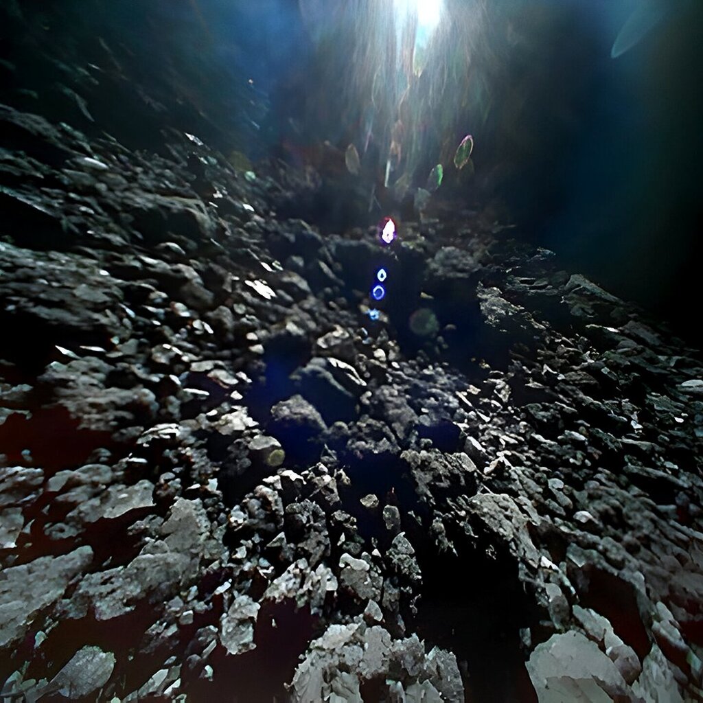 dark cave-like and rocky surface of an asteroid