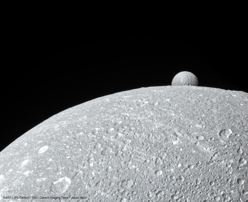 the setting of mimas setting on its larger sibling Dione