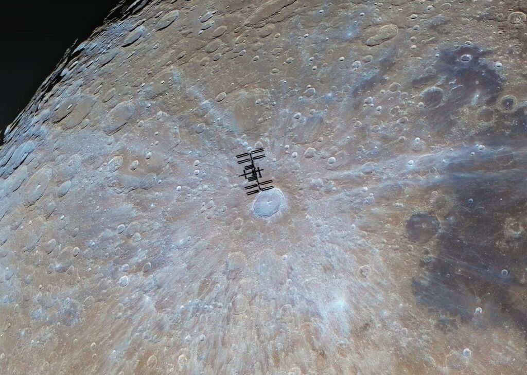 Shadow of the ISS over the moon surface