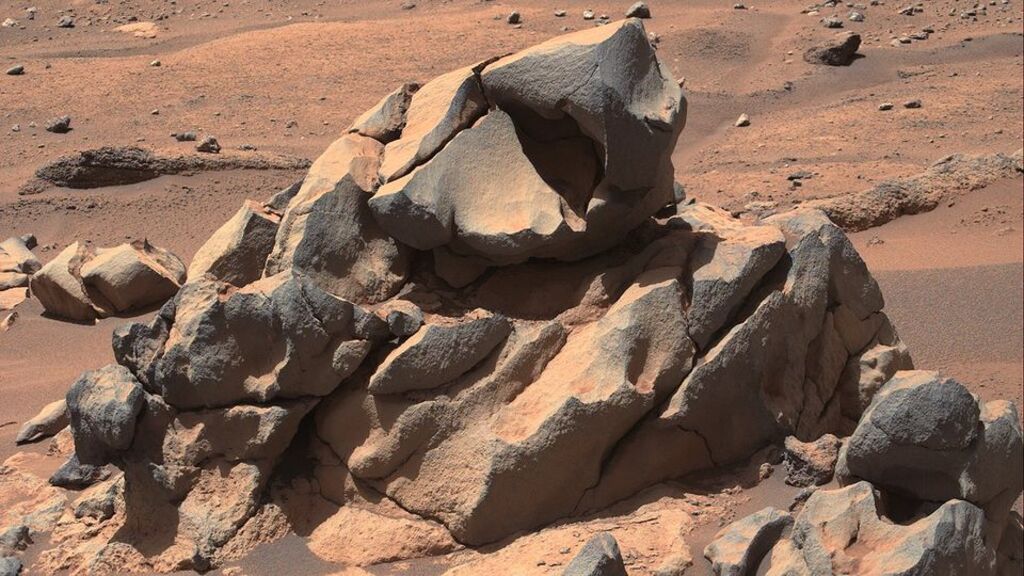 close up image of a red smooth sandy rock on Mars