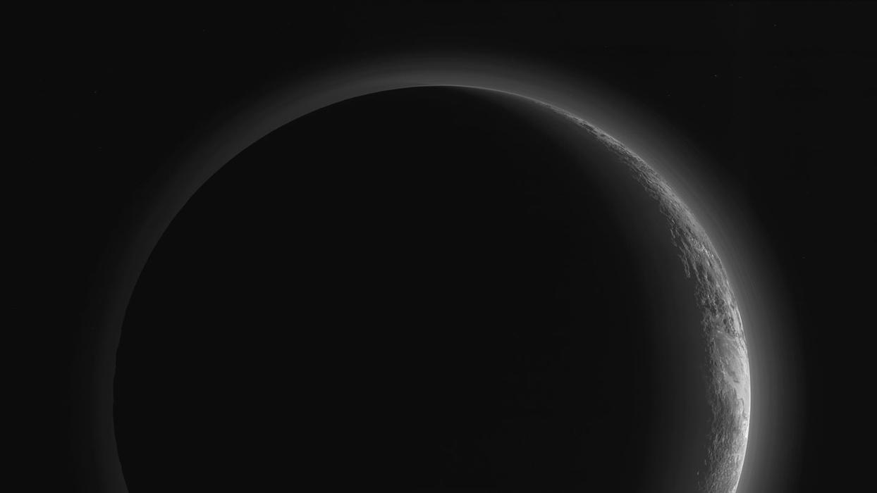 Black and White image of Pluto backlit
