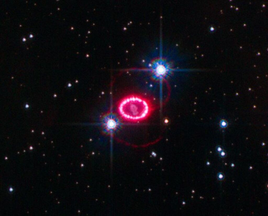 bright red ring amongst a black and starry background