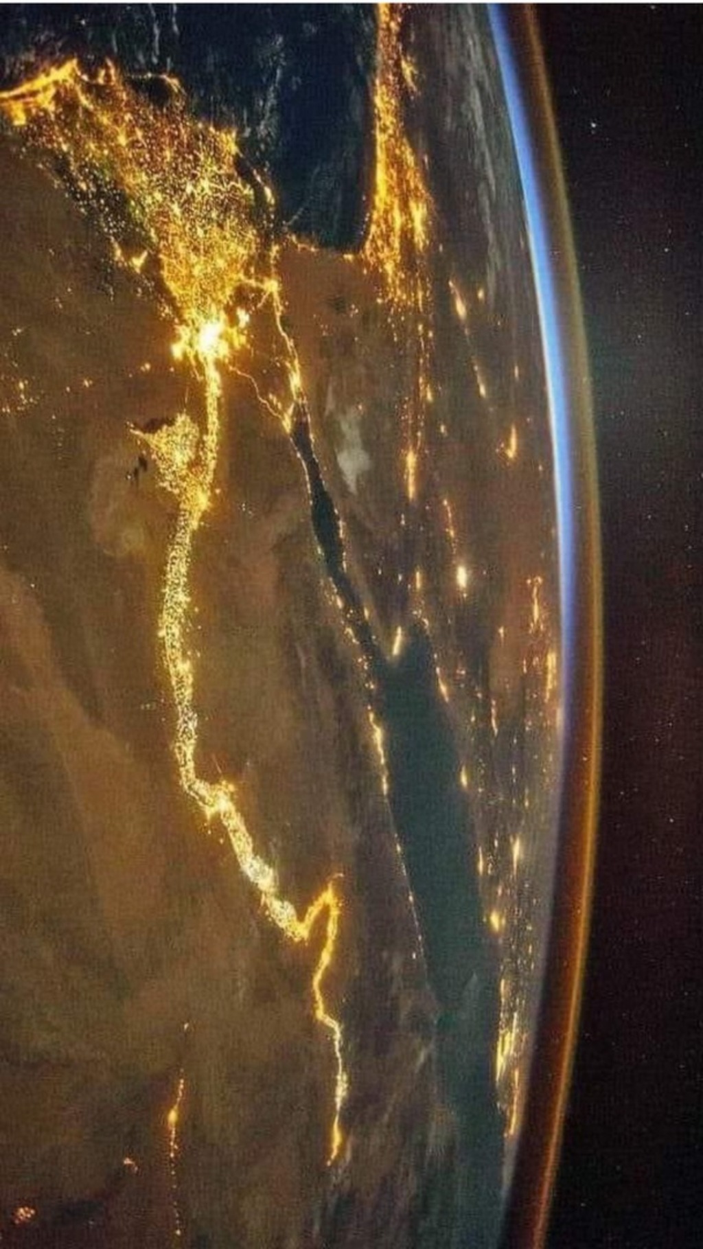 Surface of planet earth, viewing the nile river at night.