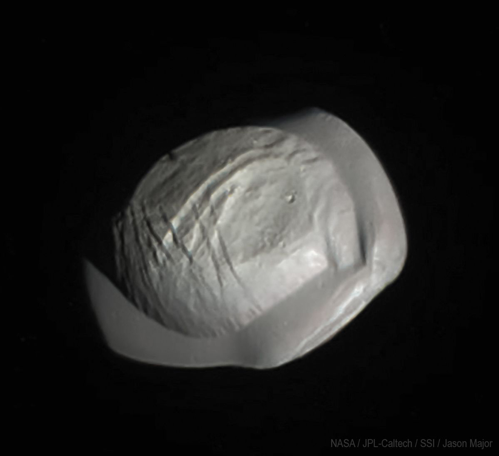 Saturn's gray moon shaped like a Raviolo