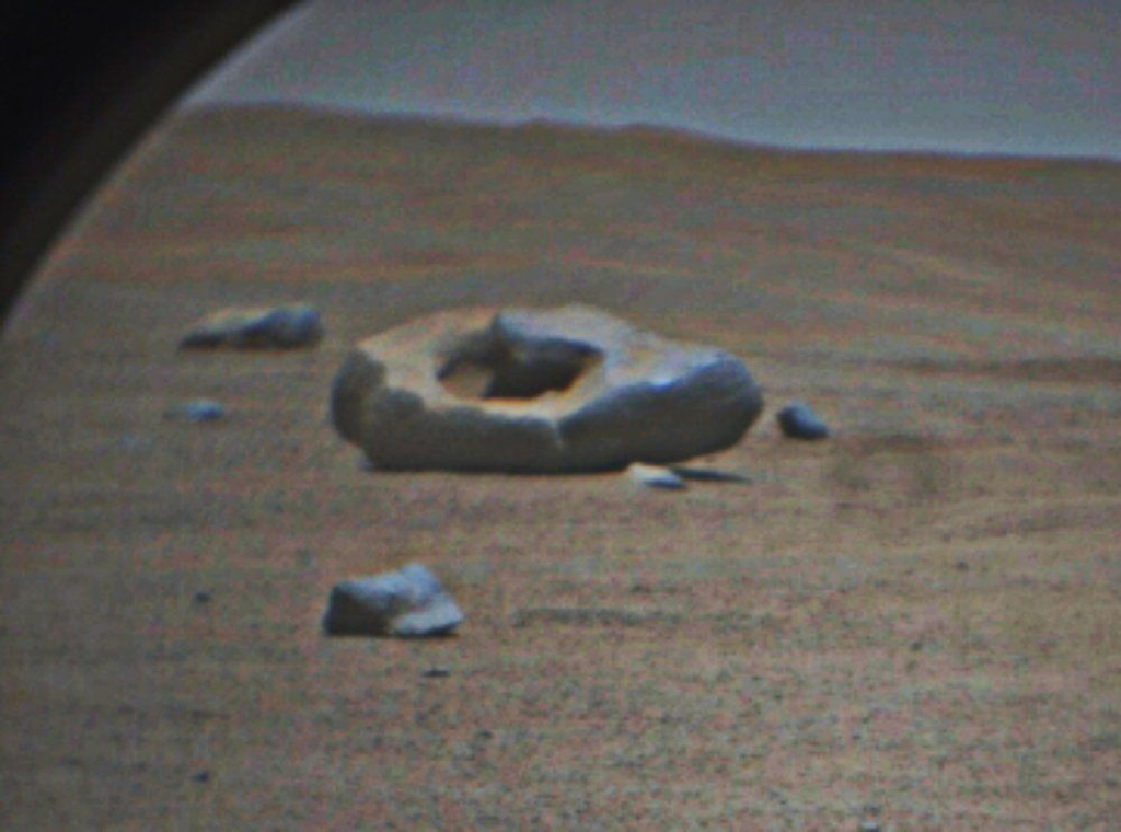 image of a donut shaped rock on Mars