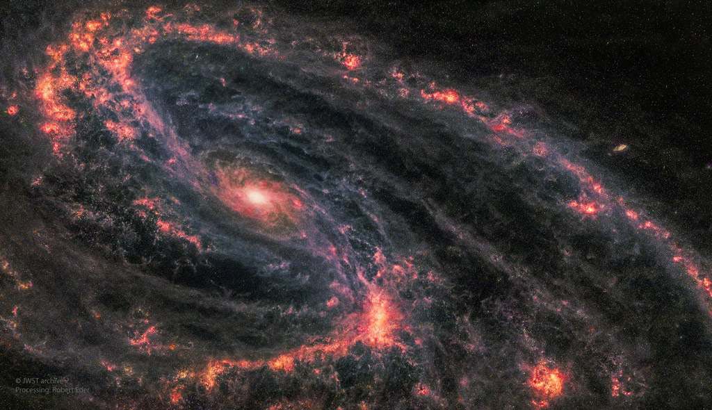 Bright red galaxy swirl against the pitch black background of outer space