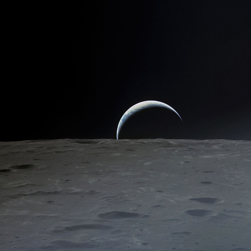 Image of the Earth peeking through the horizon of the Moon
