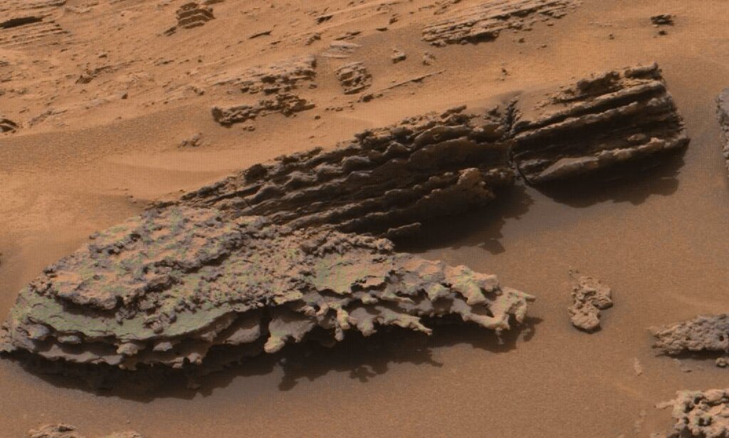 a close up image of the red rocky surface of mars