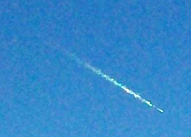 Image of a fireball in the blue earth's sky.