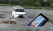Image of a car and GPS sinking in a river.