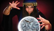Image of a fortune teller looking into a crystal ball full of money.