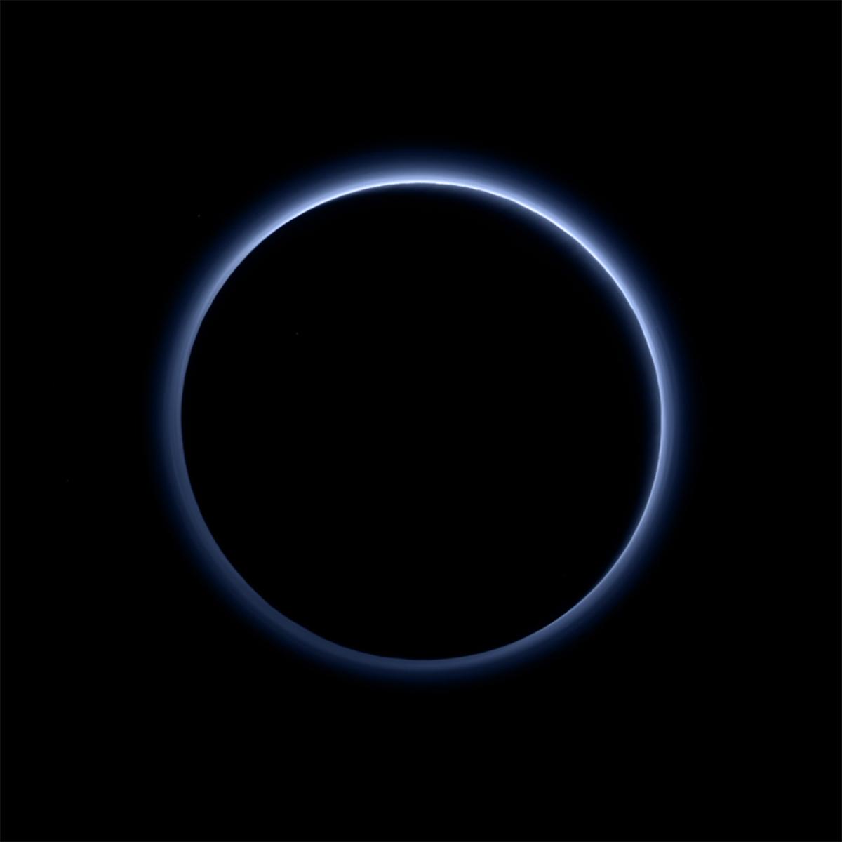 Blue ring of light surrounding a pitch black Pluto