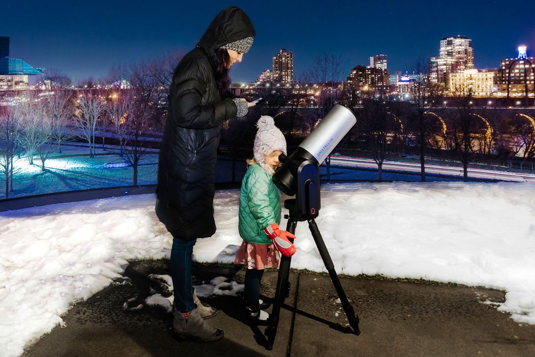 Girl looking through the eVscope.