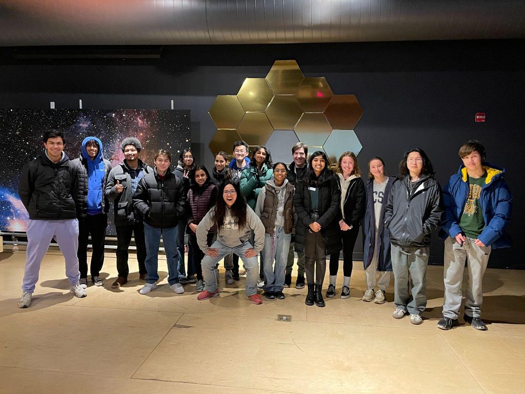 Group of students posing in front of a JWST exhibition at Chabot