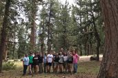 Campers and staff in the pines