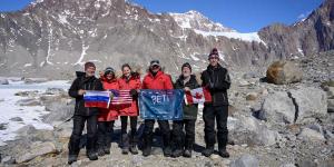 Dale Andersen and team with SETI Institute expedition flag